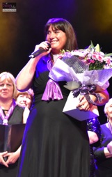 SingMe Class Leader and Administrator, Wendy Williamson, receiving a gift in appreciation of all of her hard work