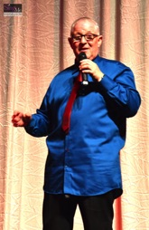 Ian Kenyon, The Huyton Poet, keeps the audience in fits of laughter during the 2016 SingMe Variety Show 